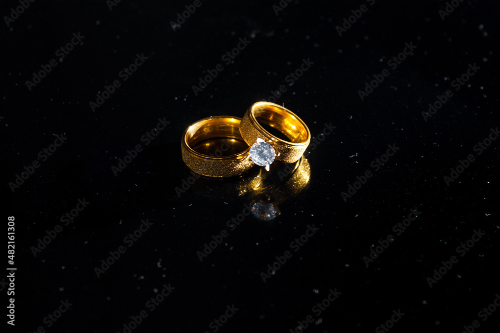 Rings on a dark background. Wedding rings. Jewelry. Rings on a dark background. Wedding rings. Jewelry.