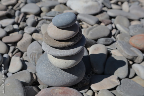 The stones on the sea beach are in the form of a slide.	
