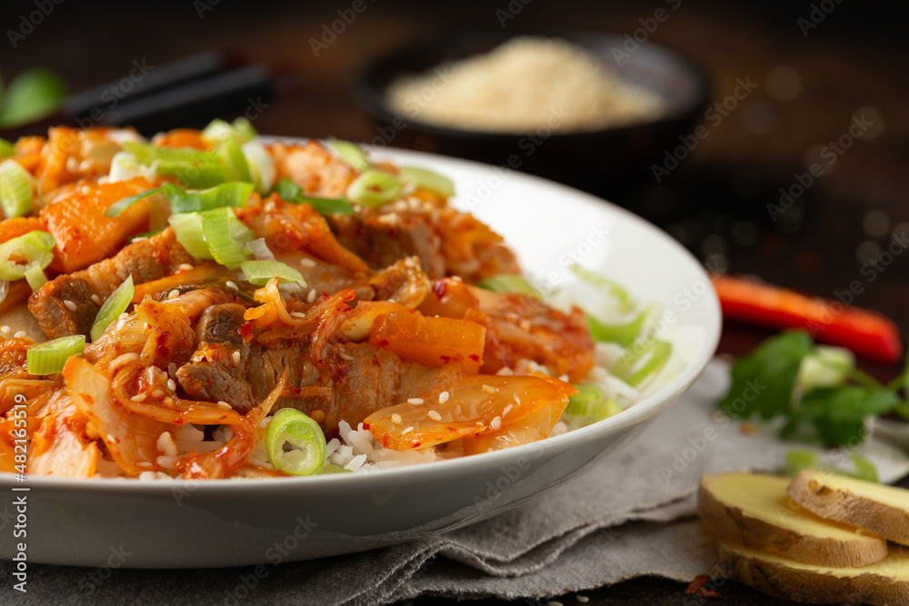 Korean Stir Fried pork belly kimchi with rice and spring onion. Asian food style Korean Stir Fried pork belly kimchi with rice and spring onion. Asian food style
