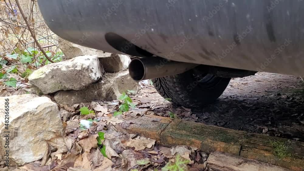 Close up of an exhaust pipe during engine start. Close up of an exhaust pipe during engine start.