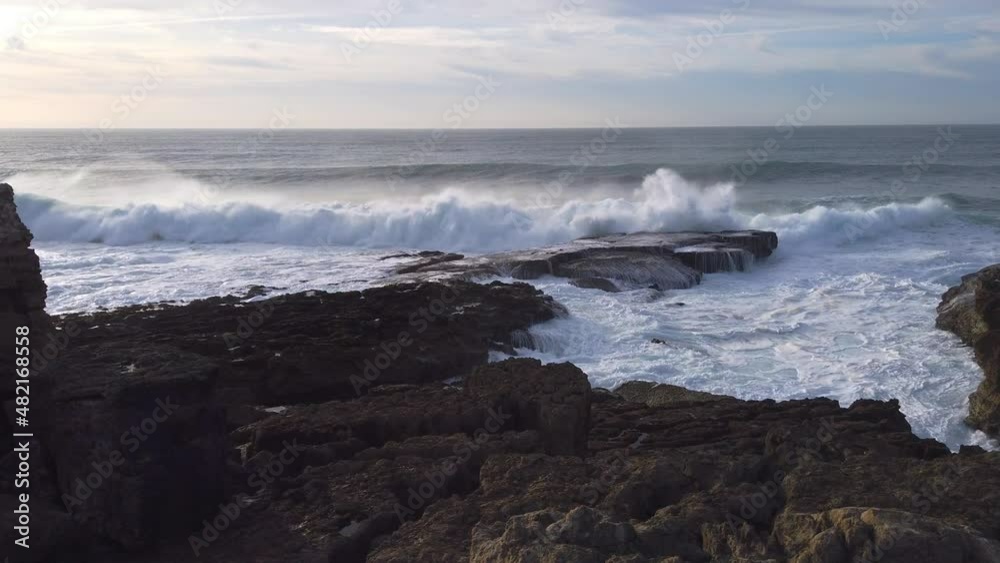 Big Ocean waves rolling and crashing against the coast, Ericeira, Portugal Big Ocean waves rolling and crashing against the coast, Ericeira, Portugal