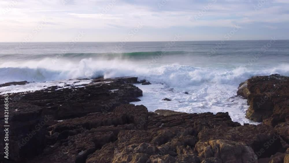 Big Ocean waves rolling and crashing against the coast, Ericeira, Portugal Big Ocean waves rolling and crashing against the coast, Ericeira, Portugal