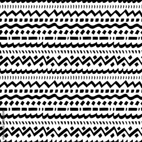 Ethnic seamless pattern with horizontal decorative stripes. Vector geometric background. Aztec tribal ornament. Black and white geometric ethnic lines and borders. For prints, textile, wrapping paper.