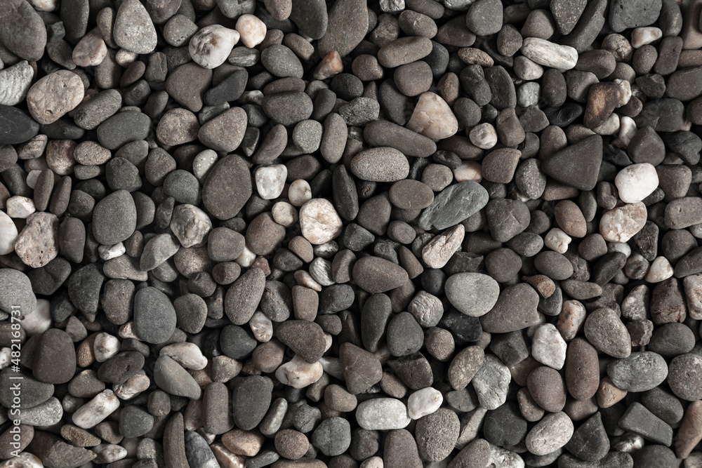 Small stone texture for background. Sea stones background. Flat lay, top view, copy space Small stone texture for background. Sea stones background. Flat lay, top view, copy space