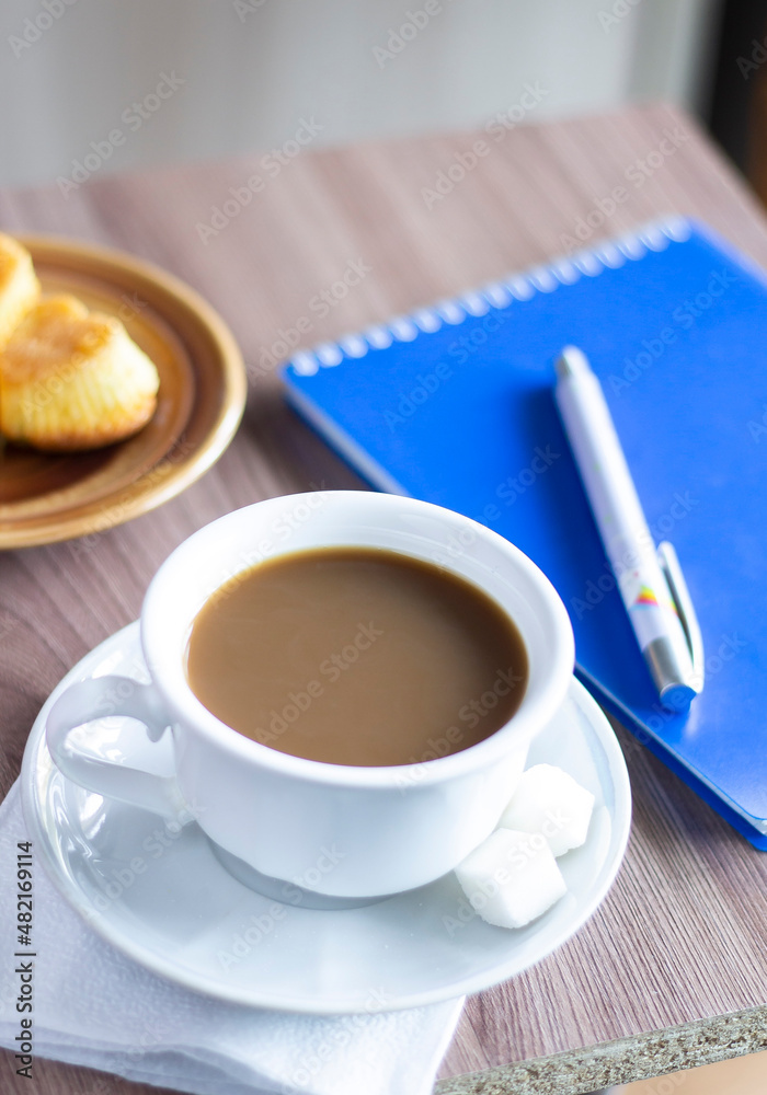 cup of coffee cakes and a note breakfast food tasty table wooden work office business style working hot drink espresso latte caffeine brown aroma sugar break beverage cup of coffee cakes and a note breakfast food tasty table wooden work office business style working hot drink espresso latte caffeine brown aroma sugar break beverage