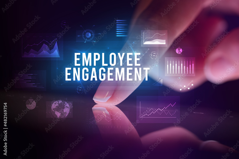 Finger touching tablet with business graphs and icons concept Finger touching tablet with business graphs and icons concept