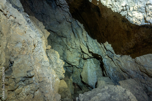 Rock formations inside a cave. Speleology and geology concept.