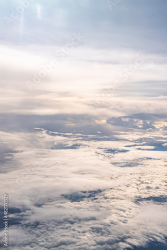 View over the clouds above Tanzania. Bright skyscape