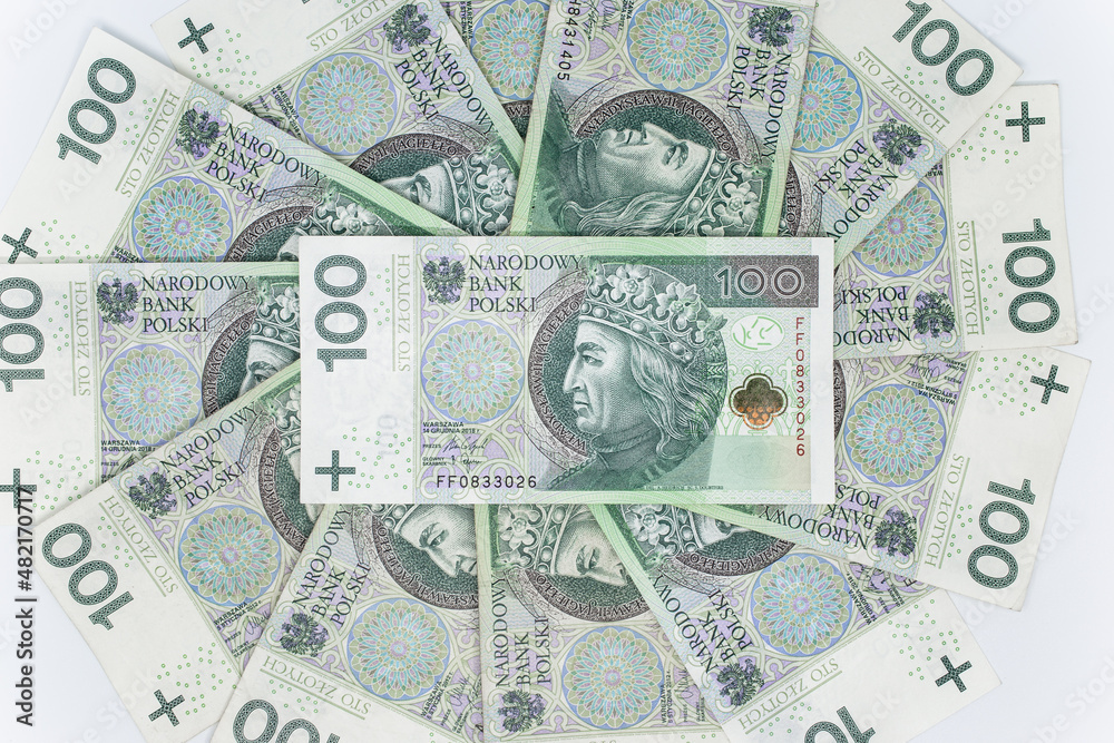 One hundred zloty - Polish banknote. Polish currency on a white background arranged in a pattern. Illustrates cash flow and business