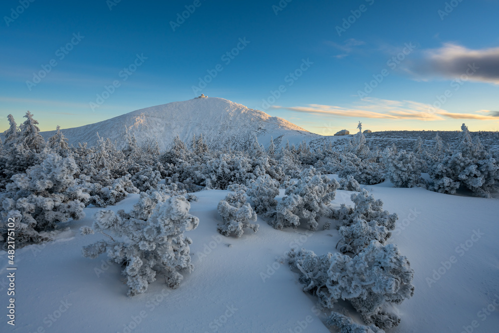 sunset under sniezka mountains in Karkonosze during winter in Poland
