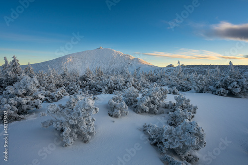 sunset under sniezka mountains in Karkonosze during winter in Poland