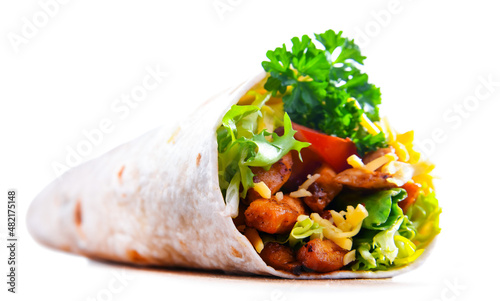 Tortilla with chicken and fresh vegetables isolated on white