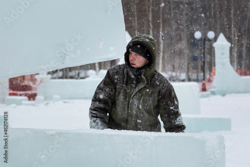 Portrait of installer at unloading ice blocks