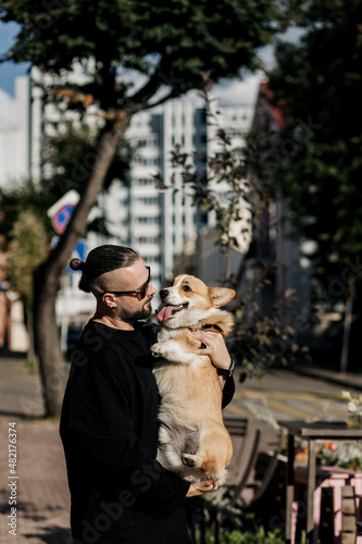 man hugging his dog