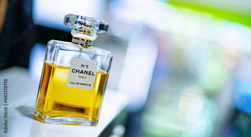 Bottles of Chanel No. 5 perfume on a store shelf Photos