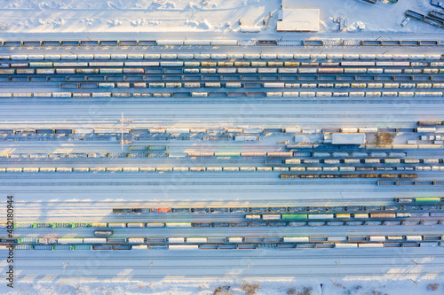 Branches of the railway at the marshalling yard, a lot of freight wagons from the height. photo