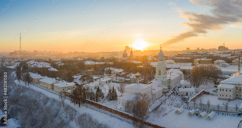 the city of Kirov and the high bank of the river Vyatka and the Alexander Grin Embankment and the rotunda on a sunny winter day.