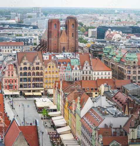Aerial view of St Mary Magdalene Church and Market Square colorful buildings - Wroclaw, Poland