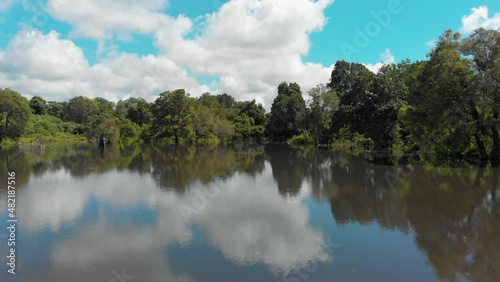 AERIAL: Lake view in Sigiriya revealing Dense Forest and Jungle, SRI LANKA photo