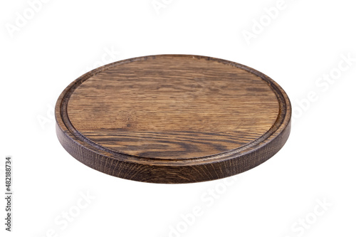 Round wooden cutting board with groove isolated on white