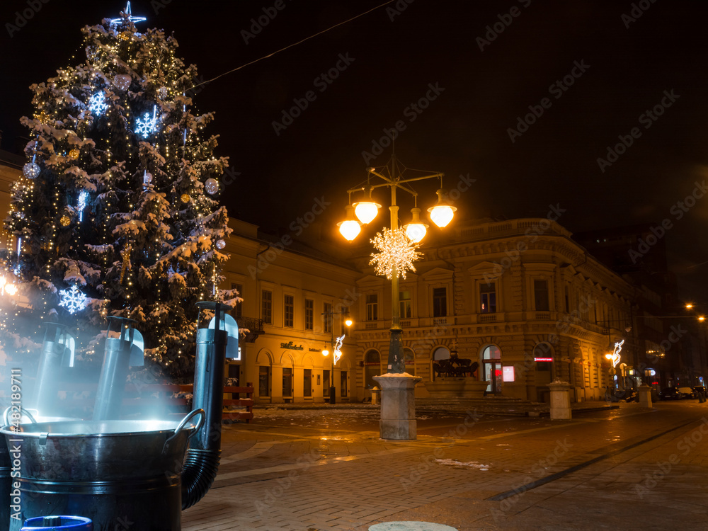 Fototapeta premium Boiling mulled wine and Christmas tree at Szeged centre
