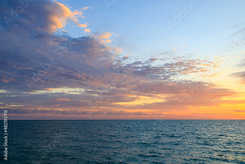 sunset on the sea, cirrus clouds during sunset. in the evening on the sea