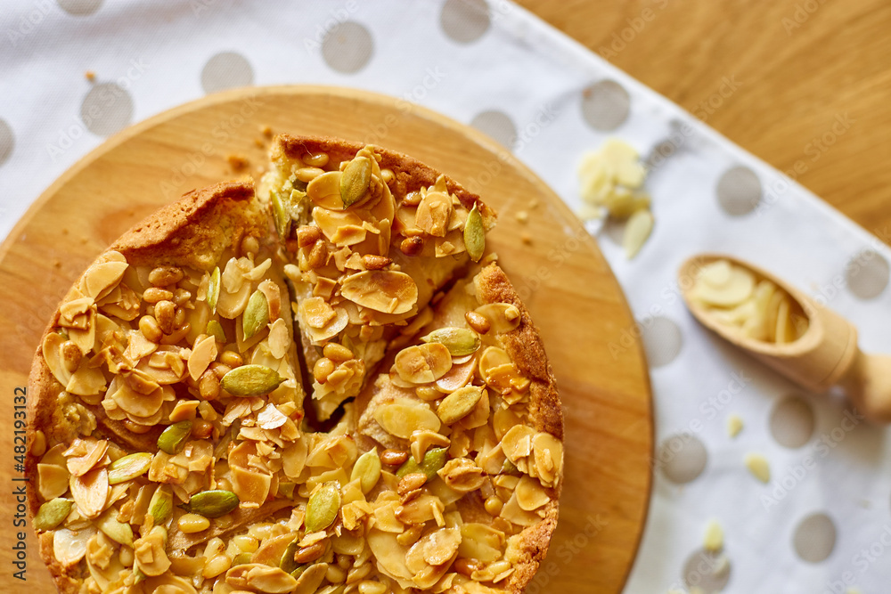 Apple or pear pie, tart with caramel nuts on wooden table, copy space, top view. Apple or pear pie, tart with caramel nuts on wooden table, copy space, top view.