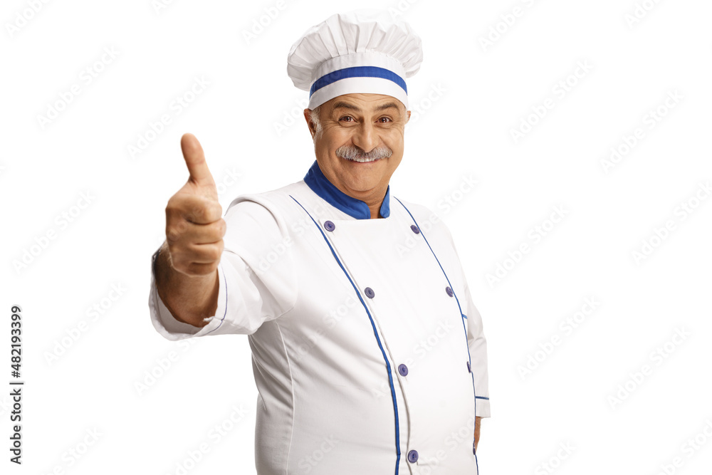 Mature male chef smiling and showing a thumb up gesture Mature male chef smiling and showing a thumb up gesture