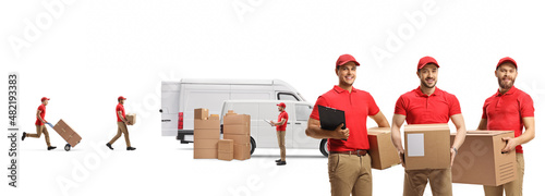 Delivery workers holding cardboard boxes and loading a van photo