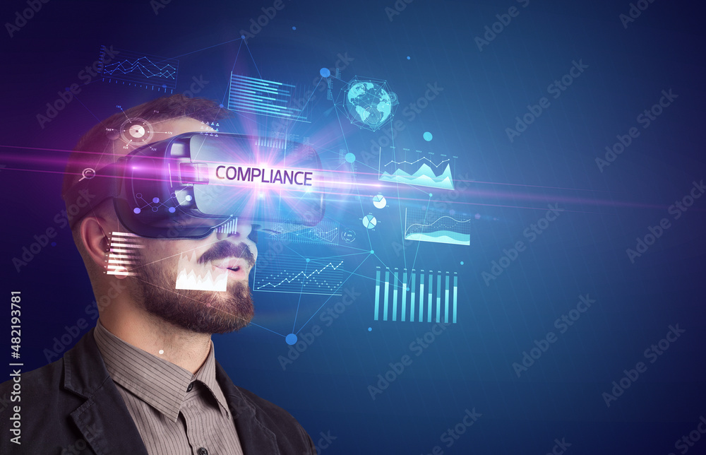 Businessman looking through Virtual Reality glasses Businessman looking through Virtual Reality glasses