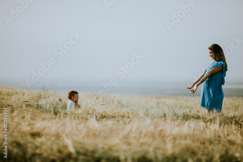 Young pregnant mother with ...