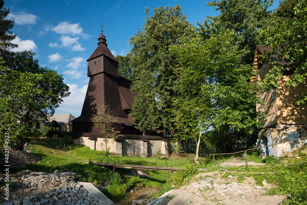 Fototapeta premium The Roman Catholic wooden Church of St Francis of Assisi in a village Hervartov, Slovakia. UNESCO Word Heritage site