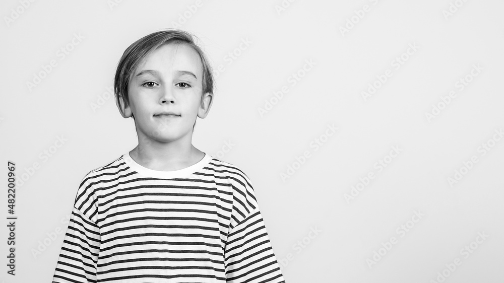 Smiling boy posing at studio. Boy looking at camera. Children style and fashion. Smiling boy posing at studio. Boy looking at camera. Children style and fashion.
