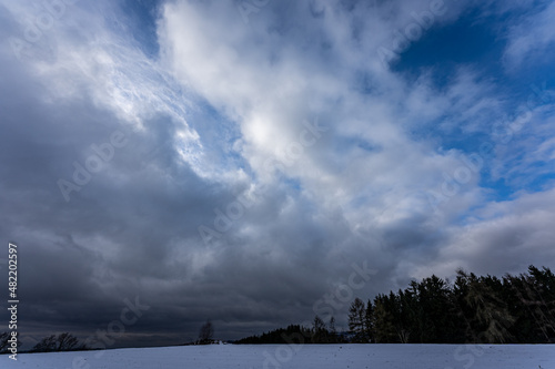 Horizon with dark dramatic sky and clouds in winter.