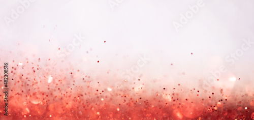 background of abstract glitter lights. orange and white.