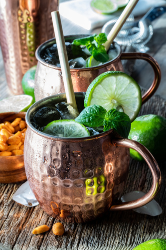 Photography Close up of a Moscow Mule mocktail with bamboo straws, ready for drinking