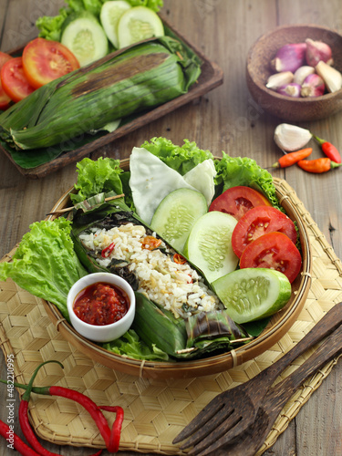 Pepes Tahu, with various spices and wrapped in banana leaves and baked. Indonesian Food. photo