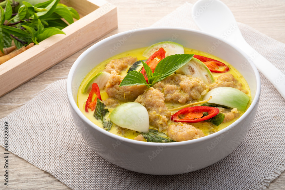Close up Thai Green Curry with Bouncy Pork and eggplant is a central Thai variety of curry (Gaeng Kiew Wan Moo Deng)