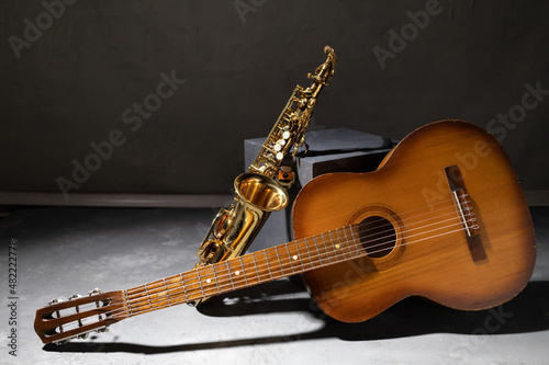 Acoustic guitar and saxophone in studio. Music concept with musical instrument
