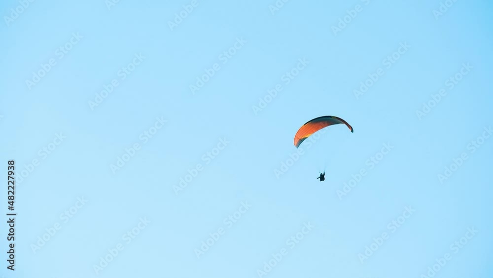 Parachutist on the background of blue sky Parachutist on the background of blue sky