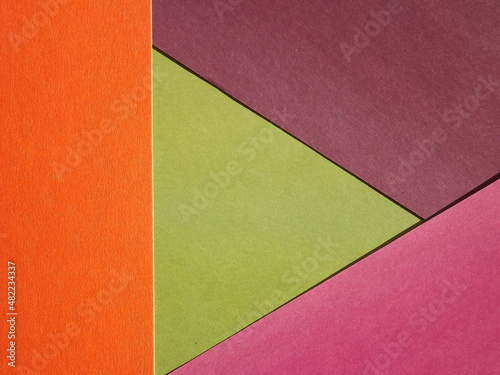 Orange green burgundy geometric surface as background. High quality photo