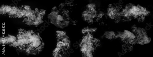 A set of eight different types of swirling, wriggling smoke, vapor isolated on a black background for overlaying