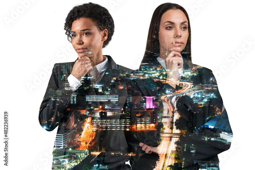 Canvas Print Two attractive businesswomen in suits, hand on chin