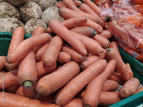 red carrots in a box ready for sale