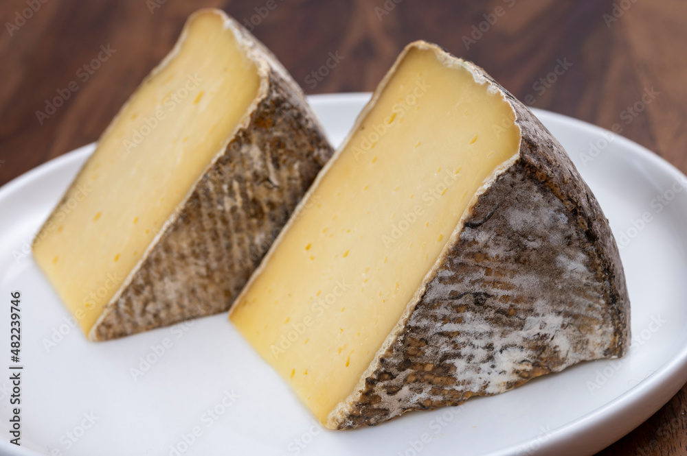 Fototapeta premium French mountain cheese from Alps, tomme de Savoie