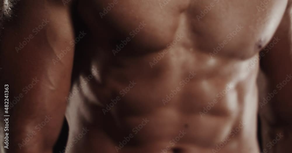 Moving around while flexing and being topless, tilt shift Moving around while flexing and being topless, tilt shift