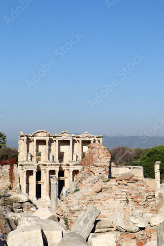 scenic view to the ruins of library of celsus in acient city Ephesus in Turkey under blue sky
