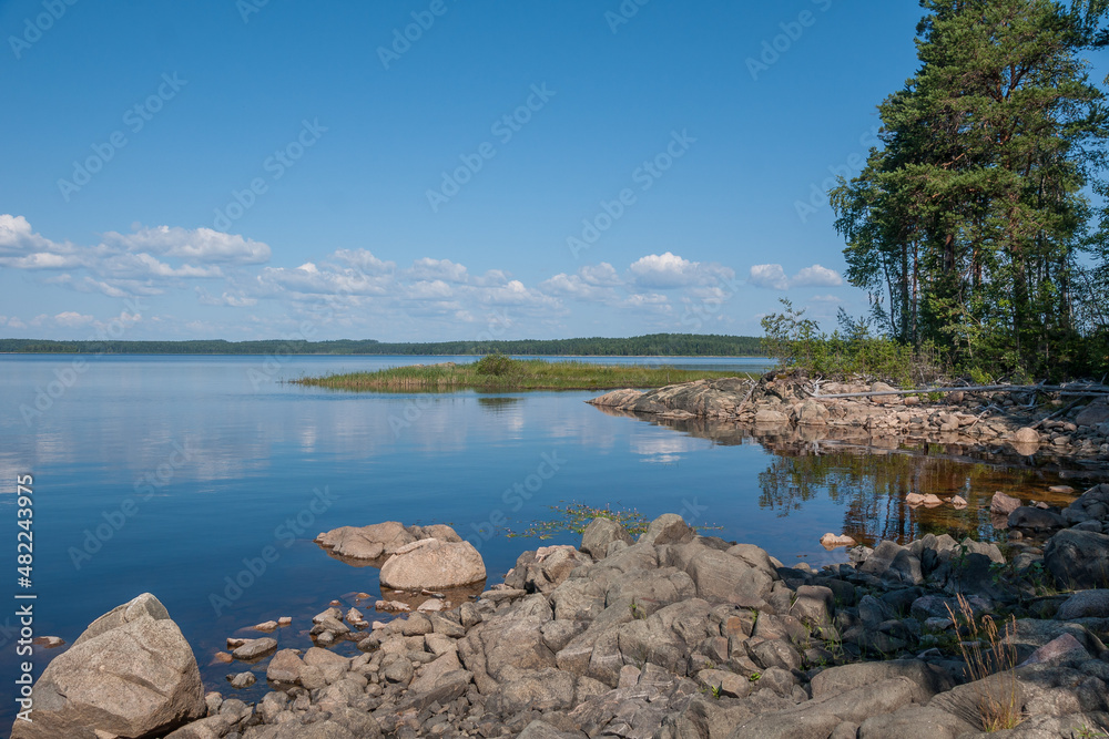 Fototapeta premium Rocky shore of Lake Panozero on sunny summer day, Karelia, Russia