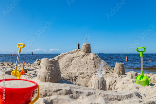 Fototapeta Naklejka Na Ścianę i Meble -  Sand buildings on the beach in Krynica Morska during beautiful sunny day at the Baltic sea.
