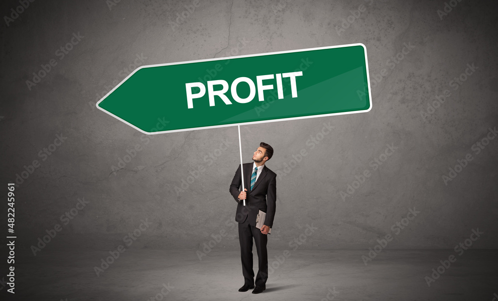 Fototapeta premium Young business person in casual holding road sign